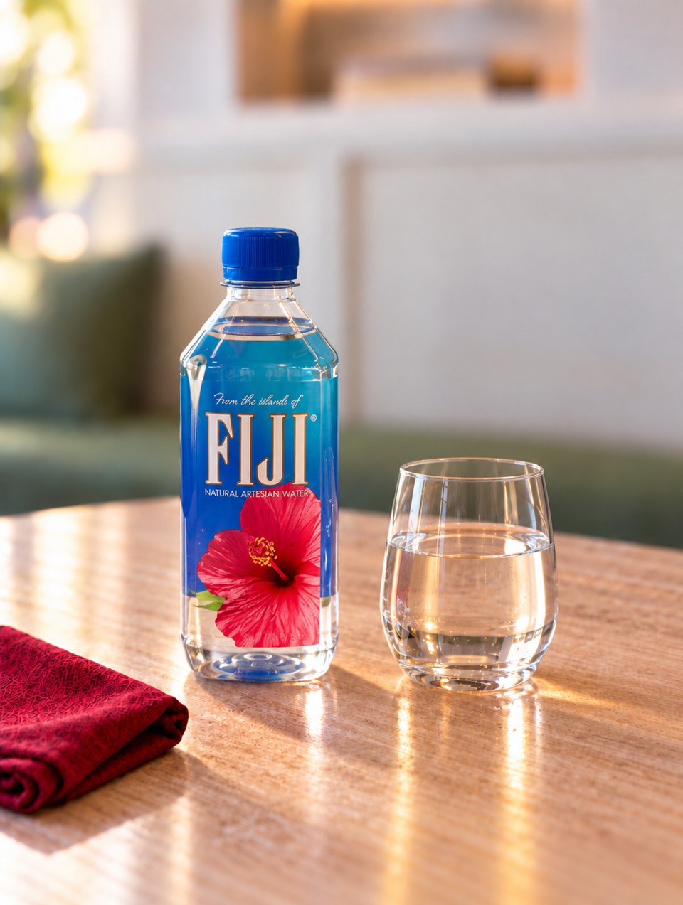 FIJI water bottle with a glass of water