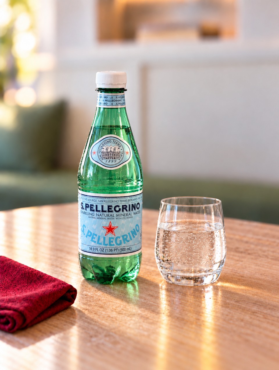 S.Pellegrino bottle with a glass of sparkling water